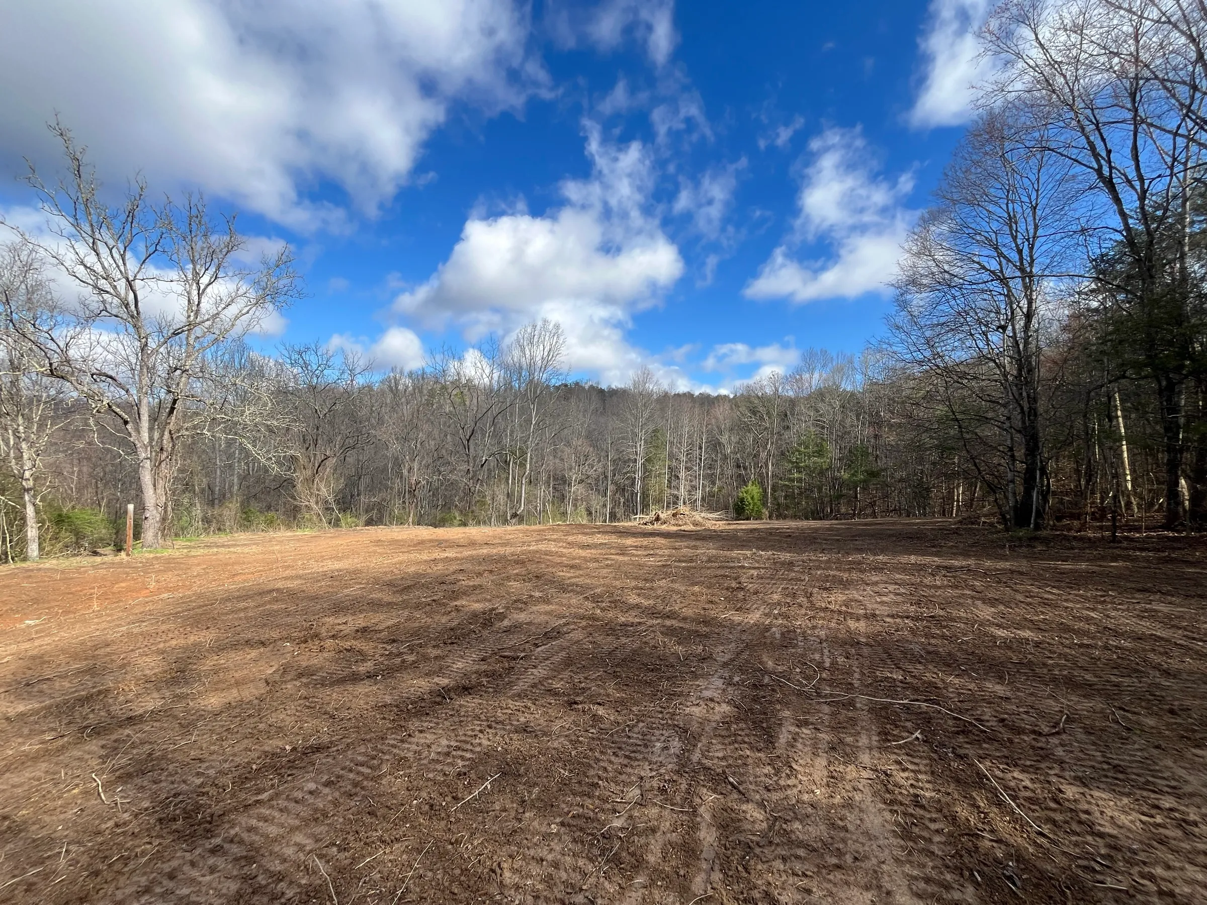 Open Tennessee land under a blue sky, ready for its next chapter